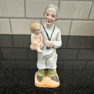 Vintage Ceramic doctor Figurine of doctor with Child